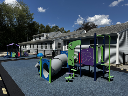 Clean commercial playground and shared exterior area